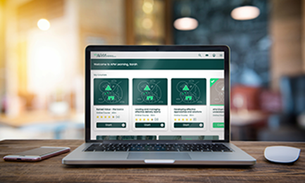APM Learning dashboard view on a laptop